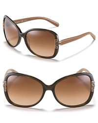 Tory Burch adds her signature look to these oversized sunglasses with metal T detail at temples.