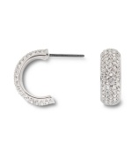 Covered in glittering pave crystals, Swarovski's huggie hoop earrings are a chic, classic look that's versatile enough to take you from the office to a night on the town! Set in silver tone mixed metal. Approximate diameter: 1/2 inch.