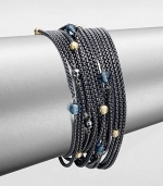 From the Chain Collection. A fluid design with multiple rows of blackened sterling silver box chains accented with 18k gold, hematite and blue topaz stations. Blackened sterling silver18k gold, hematite and blue topaz beadsLength, about 7.25Bar clasp closureImported 