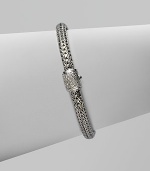 Diamond clasp accents sterling silver and 18K white gold chain bracelet. Pavé diamond, 0.17 tcw Push button close 7½ long Hand made in Bali