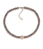 Autumnal appeal. Gorgeous brown glass pearls and a sparkling fireball charm make this Carolee necklace a perfect addition for your fall wardrobe. Crafted in gold tone mixed metal. Approximate length: 16 inches + 2-inch extender.