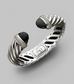 From the Waverly Collection. Sculpted cable design of sterling silver with pavé diamonds and black onyx tips. Diamonds, 0.76 tcw Diameter, about 2¼ Width, about 1¾ Hinge close Imported