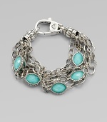 Stations of bright, faceted, crystal accented turquoise stone set in sterling silver on detailed link chains. Crystal accented turquoise doubletsSterling silverLength, about 7Lobster clasp closureImported