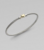 From the Cable Heart Collection. A thin signature cable band with a delicate 18K gold heart.Sterling silver 18K yellow gold Width, about 3mm Hook closure Imported 