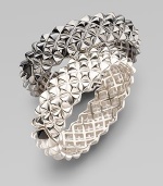 Fabulously crafted sterling silver bangle displays a sculptural stud pattern with one contrasting stud at the clasp. Sterling silver Diameter, about 2½ Width, about ¾ Hinged with clasp Imported Please note: Bracelets sold separately.