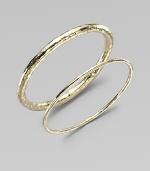 A simple, sophisticated, substantial bangle of 18k yellow gold with a rich hammered texture. 18k yellow gold Diameter, about 2½ Imported Please note: Bracelets sold separately.