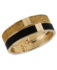 A totally dynamic duo. Betsey Johnson's two bangle set makes quite the statement in chic, contrasting colors. Crafted in gold tone mixed metal with a glitter overlay and secure hinge clasp. Approximate length: 8 inches. Approximate diameter: 2-3/8 inches.