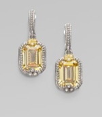 From the Estate Collection. An emerald-cut canary crystal stone set in a textured sterling silver, sparkling with white sapphires and accented in 18k gold.Canary crystalWhite sapphireSterling silver18k goldHinge-and-post backDrop, about 1¼Imported 