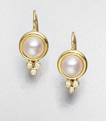 Luminous elegance in this diamond accented cultured pearl design in radiant 18k gold. Cultured pearls18k goldDiamonds, .09 tcwLength, about .8Hook backMade in Italy