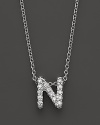 From the Tiny Treasures collection, a diamond N necklace. With signature ruby accent. Designed by Roberto Coin.