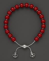 Varnished red wooden beads on a sterling silver bracelet from Gucci.