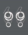 Let chic circles orbit your earlobes. These funky asymmetrical earrings feature interlocking circles set in sterling silver. Approximate drop: 2 inches.