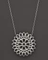 An applique pendant in sterling silver on a chain, designed by Paul Morelli.