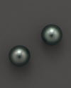 Naturally colored, cultured Tahitian black pearls make a statement on delicate stud earrings. From Tara Pearls.