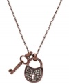 Secure your new look. This glitzy necklace from Fossil features lock and key pendants embellished with hematite pave crystals. Crafted in brown ion-plated stainless steel. Approximate length: 16 inches + 2-inch extender. Approximate drop: 7/8 inch.