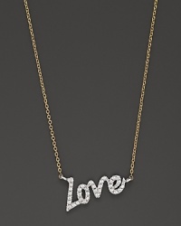 Slim, elegant text is crafted in 14K yellow gold and set with faceted diamonds. By Meira T.