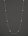 This sterling silver necklace, gleaming with aquamarine, makes an elegant statement. By Di MODOLO.