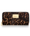 Opt for an exotic vibe with this posh, leopard print design from MICHAEL Michael Kors. Soft haircalf is accented with luxe leather and golden hardware, while the pocket-lined interior holds cash, cards, coins and ID.