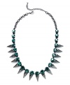 Look sharp with this necklace from Bar III. Crafted from hematite tone mixed metal, the necklace is adorned with spikes and emerald glass crystals for a bit of fashion on the edge. Approximate length: 16 inches + 2-inch extender.