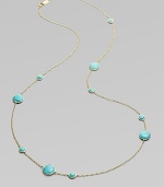 From the Lollipop Collection. Multi-sized, turquoise cabochons, elegantly placed on either side of a radiant, 18k gold chain. Turquoise 18k gold Length around neck, about 37 Diameter, about ¼ - ½ Lobster clasp ImportedPlease note: Due to the characteristics of natural stone, color and pattern may vary slightly. 