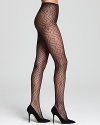 HUE combines a swirling geometric print with fishnet tights for a luxe leg look. Style #U13110.