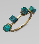 An architectural piece with four turquoise cube stones on a hinged bangle. TurquoiseBrassDiameter, about 2½Hinged closureMade in USA