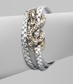 From the Naga Collection. A braid of rich leather wraps the wrist three times while weaving in and out of a curvaceous silver dragon.LeatherSterling silverLength, about 6½Lobster claspMade in Bali