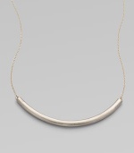 Eye-catching in its elegant simplicity, a gracefully curved, matte-finished silver bar appears to float on a delicate golden chain.SilverplatedGoldtoneLength, about 18Hook claspMade in USA