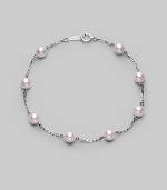 From the Akoya Collection. A delicate chain, sprinkled with lustrous white cultured Akoya pearls. 5mm white, round cultured pearls Quality: A+ 18k white gold Length, about 7 Spring ring clasp Imported