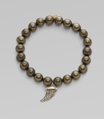 This pyrite beaded, stretch design is accented with a diamond embellished 14k gold and rhodium horn charm for a modern look. Pyrite beads14K goldDiamonds, .22 tcwLength, about 6¾Elastic slip-on styleMade in USA of imported materials