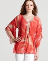 Ignite your look in this Shiloh770 tunic emblazoned with a swirl of fiery hues and a shimmering sequin neckline.