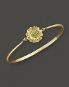 A faceted lemon quartz adds brilliant color to gleaming 18K yellow gold. By Carelle.