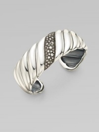 From the Cable Wrap Collection. This iconic style features a center band of pavé diamonds. Diamonds, .57 tcw Sterling silver Diameter, about 2¼ Imported 