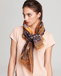 A sophisticated center pattern, subdued leopard print and bright orange background make up this stunning scarf from Emilio Pucci.