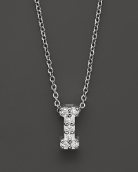 From the Tiny Treasures collection, a diamond I necklace. With signature ruby accent. Designed by Roberto Coin.