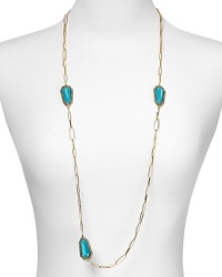 Alexis Bittar's long chain necklace boasts beautiful turquoise stations with crystal encrusted bezeled settings. Drape it on over a slinky knit or silky dress for added drama.