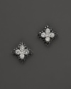 Black and white diamonds sparkle in 14K. white gold settings.