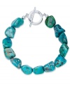 Add a touch of turquoise. Avalonia Road's pretty toggle bracelet features asymmetrical nuggets of turquoise (21 ct. t.w.) in sterling silver. Approximate length: 7-1/2 inches.