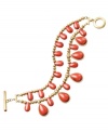 Infuse your style with tropical hues. Lauren by Ralph Lauren's vibrant two-row bracelet features teardop-shaped reconstituted coral beads set in gold tone mixed metal. Approximate length: 7-1/2 inches.