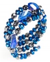 Feel the blues. Shades shine in this coil bracelet from Style&co. Glass beads in blue give this piece an uplifting feel. Approximate length: 7 inches.