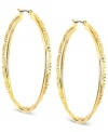 Anne Klein puts its own twist on a classic. This pair of hoop earrings is crafted from gold-tone mixed metal, and features a shapely and stylish look. Approximate diameter: 1 inch.