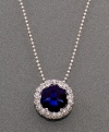 The only piece of jewelry you'll need to make your mark. CRISLU's mesmerizing round-cut blue corundum (2 ct. t.w.) pendant is surrounded by glittering cubic zirconia (3/4 ct. t.w.). Crafted in platinum over sterling silver. Approximate length: 26 inches. Approximate drop: 1/2 inch.