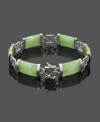 The perfect look to complement your unique style. This beautifully-crafted bracelet highlights rectangular jade links (9 mm x 18 mm) set in polished, sterling silver cut-out symbols. Approximate diameter: 2-3/4 inches.