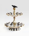 A beautifully handcrafted, tiered ceramic stand in a checkerboard juxtaposition of ivory and onyx with gold luster. The perfect addition to a buffet or party is fired three times for added strength to last a lifetime.Hand-painted and -glazed11.5 tallFluted plates, 9 diam.Hand washMade in the USA