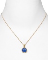 This haute bohemian pendant necklace from Coralia Leets charms with rich texture and hue. The gleaming gold setting sets off a blue chalcedony stone.