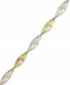 The perfect twist of two-tone metallics. Giani Bernini's versatile bracelet combines links of sterling silver and 24k gold over sterling silver. Approximate length: 7-1/2 inches.