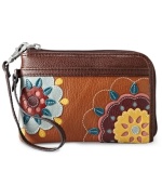 This free-spirited design from Fossil gives a nod to '70s flower power fashion. Rich leather is adorned with whimsical floral patchwork, while the versatile wristlet strap provides a hands-free look.