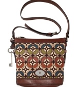 Simple and seriously chic, this cool crossbody from Fossil reels in old school charm with a contemporary attitude. Mod tapestry, leather trim and signature hardware add depth and dimension, while the spacious interior stashes your everyday essentials with ease.