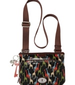 Add some vintage-inspired attitude to your everyday accessorizing with this colorful crossbody from Fossil. Durable coated canvas is outfitted with a fun pattern and signature hardware, while the interior offers plenty of pockets to stash your everyday essentials.