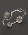 Faceted pyrite doubles dot a sterling silver bangle from Ippolita.